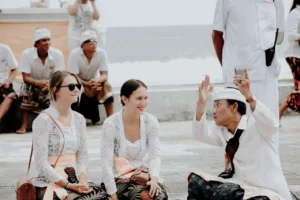 tourists talking to Balinese people